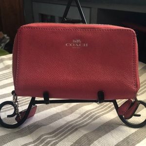 Coach double zip wallet in pink.